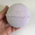 I Love Beddy bath bomb side view in hand